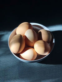 High angle view of eggs in bowl on table