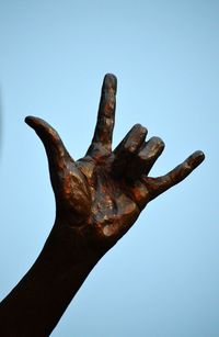 Low angle view of statue against clear blue sky