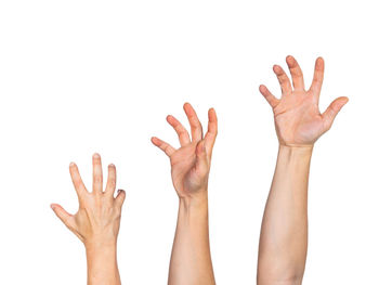 Low angle view of human hand against white background