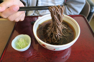 High angle view of person having food on table