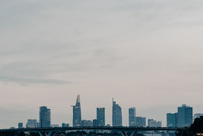 City skyline against cloudy sky