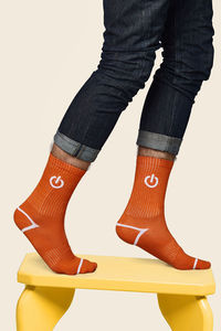 Low section of woman standing against white background