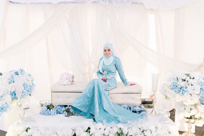 Portrait of bride sitting at wedding reception