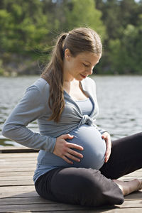 Pregnant woman on jetty