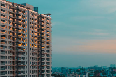 View of residential buildings against sky