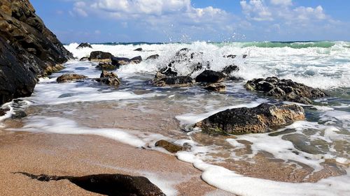 Sea waves splashing on rocks