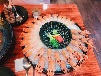 High angle view of fish in plate on table