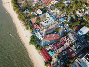 High angle view of buildings and trees in city