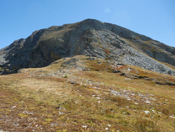 Low angle view of rocky mountain against sky near colle sibolet