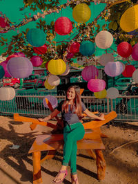 High angle view of woman standing on balloons