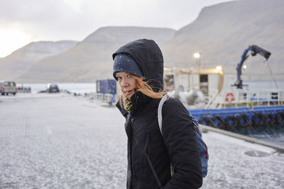 Female hiker looking back at camera in the faroe islands