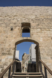 Low angle view of old ruin building against sky