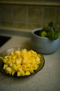 Close-up of yellow fruits in bowl