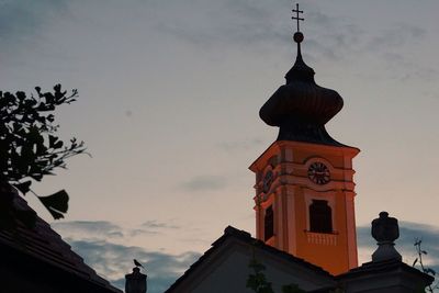 Low angle view of clock tower against sky