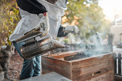 Midsection of man preparing food