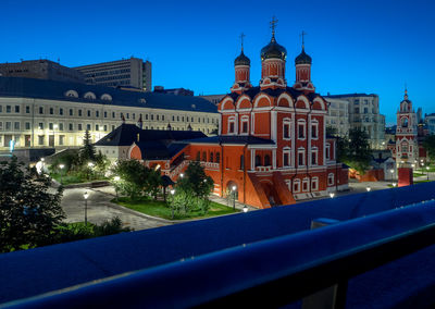 Buildings in city at night