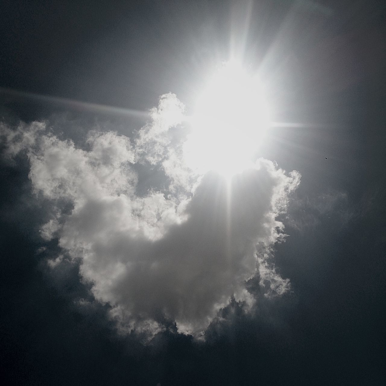 sun, low angle view, sunbeam, sky, sunlight, cloud - sky, beauty in nature, tranquility, nature, lens flare, scenics, tranquil scene, sky only, bright, cloud, silhouette, cloudy, sunny, day, cloudscape