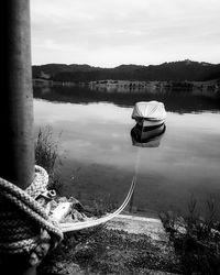 Man on lake against sky