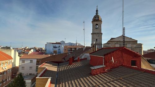 View of buildings in city against sky