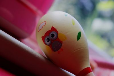 Close-up of multi colored balls on table