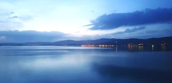 Scenic view of lake against blue sky