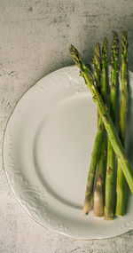 High angle view of vegetables in plate on table