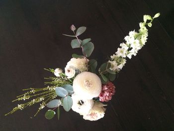 High angle view of rose bouquet in vase on table