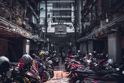 People on street amidst buildings in city