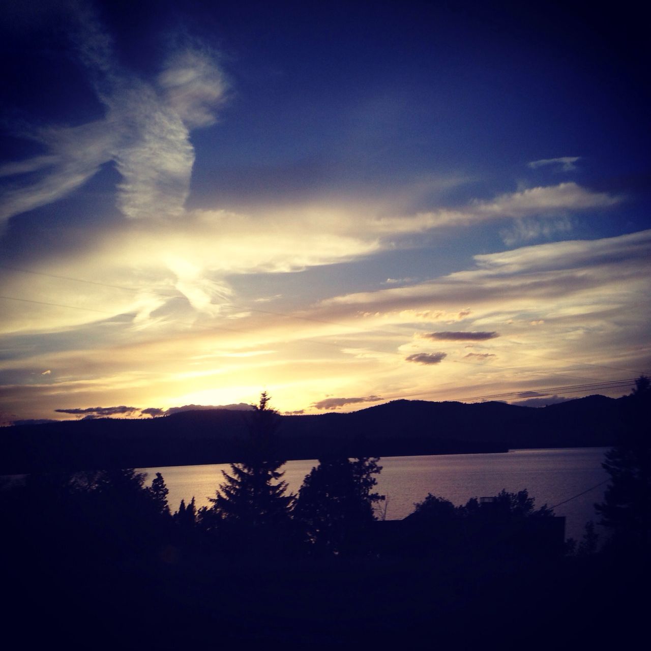 sunset, silhouette, tranquil scene, water, sky, tranquility, scenics, beauty in nature, lake, reflection, nature, cloud - sky, idyllic, cloud, tree, calm, orange color, river, dusk, outdoors