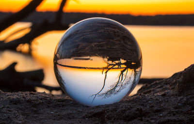 Close-up of crystal ball on rock