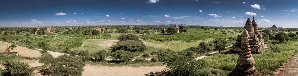 Panoramic shot of agricultural field against sky