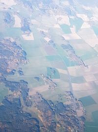 High angle view of airplane flying over land