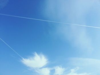 Low angle view of vapor trails in sky