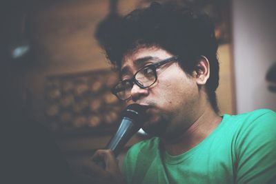 Close-up of man talking on microphone