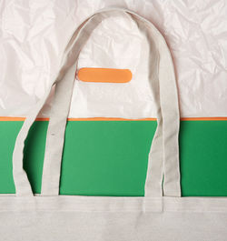 Beige textile eco-friendly bag and white plastic bag, flat lay. the concept of rejection of 