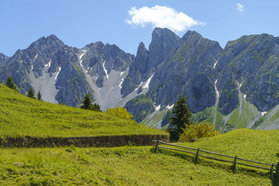 Scenic view of landscape and mountains against sky