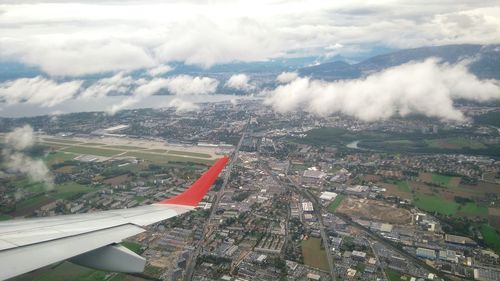 Aerial view of airplane wing over landscape