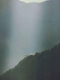 Scenic view of mountains in foggy weather