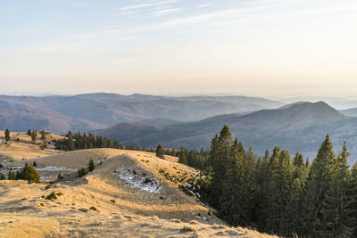 Scenic view of landscape against sky during sunset