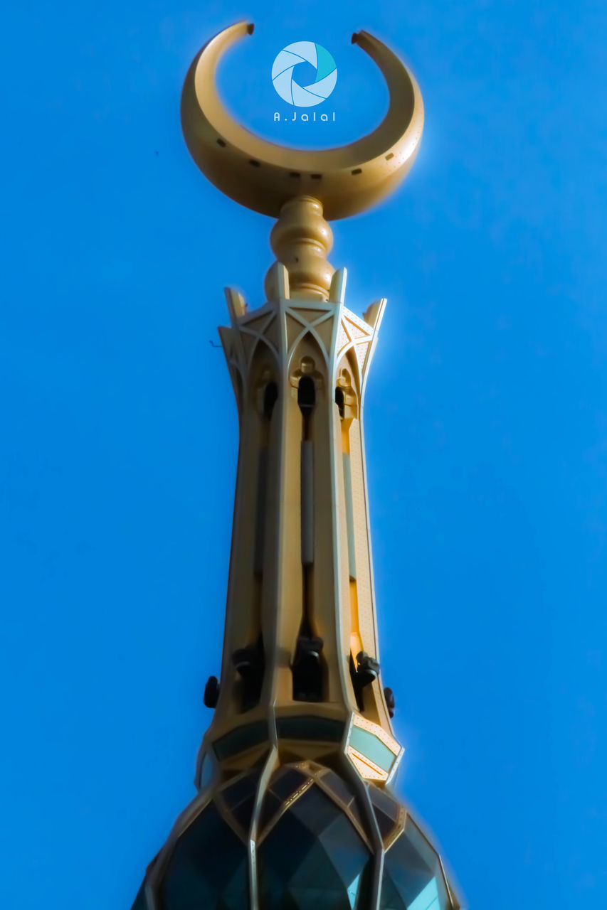 low angle view, blue, clear sky, communication, religion, clock, text, human representation, copy space, architecture, day, high section, built structure, no people, church, time, guidance, cross, spirituality