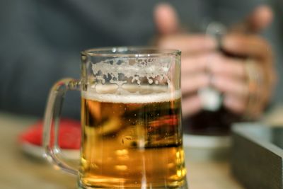 Close-up of beer glass on table