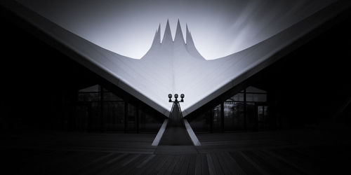 Low angle view of illuminated building against sky