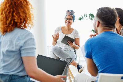 Group of people discussing at office