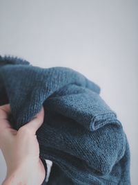 Close-up of human hand against white background