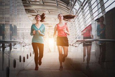 Full length of women standing in corridor