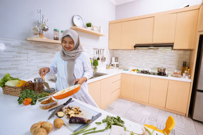 Woman eating food at home