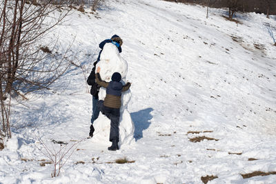 Full length of man walking on snow