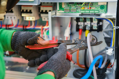 Close-up of man working at machine