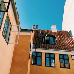 Low angle view of building against clear blue sky