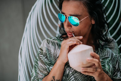 Close-up portrait of a woman drinking drink